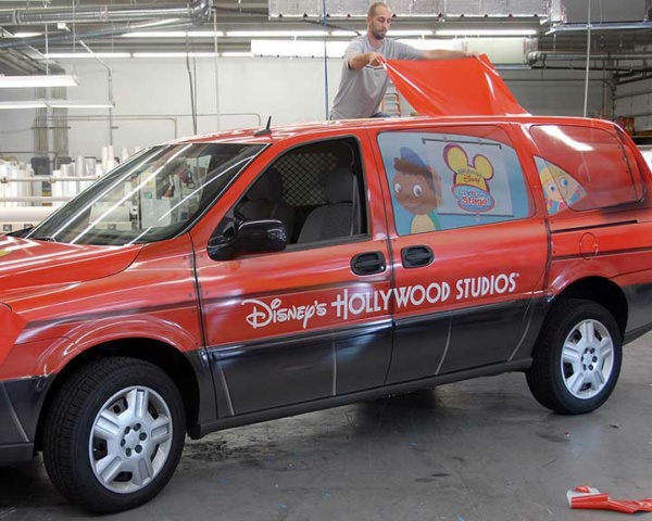 SUV wrap installation featuring Disney-themed graphics