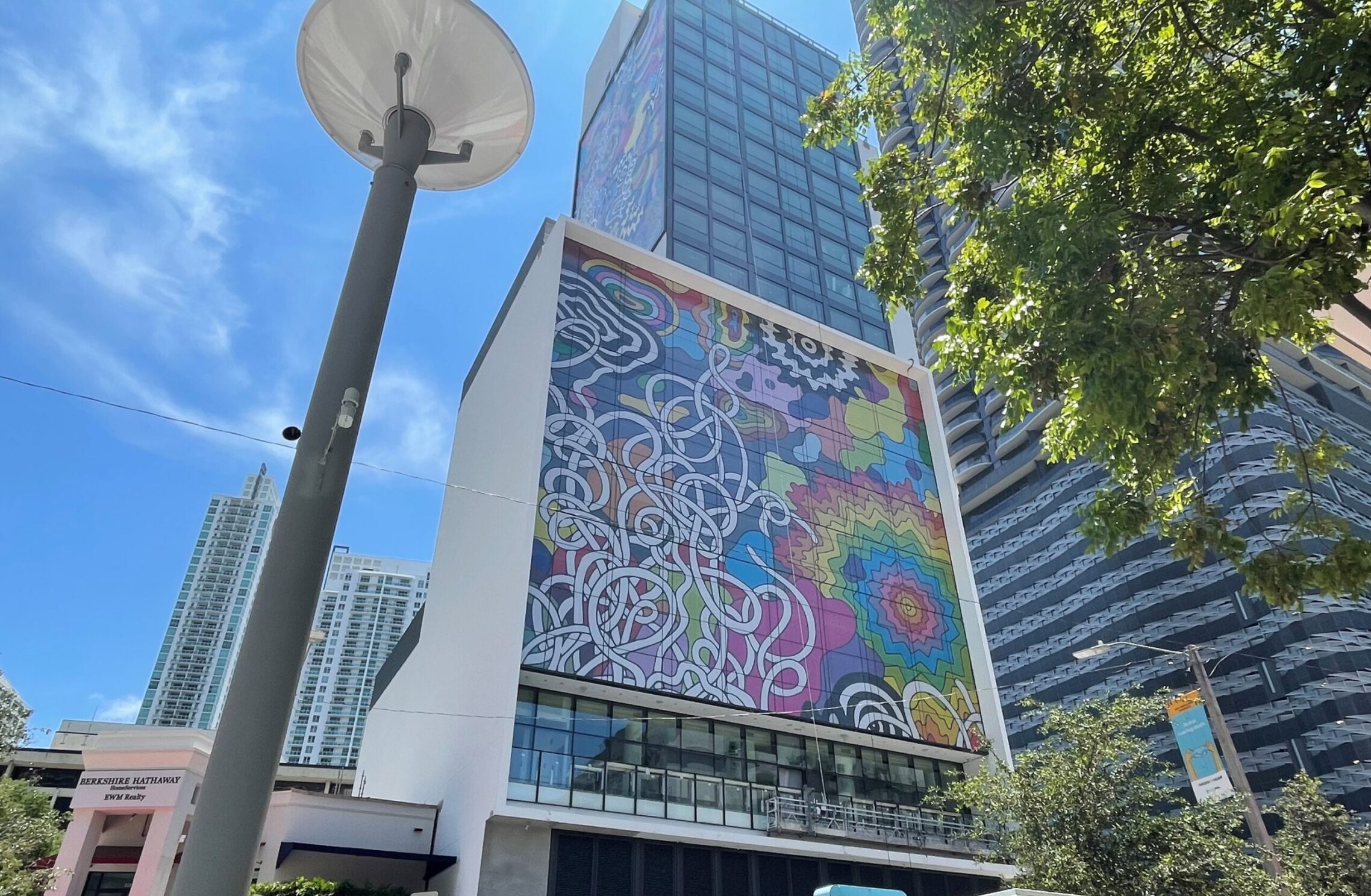 Exterior wall mural building wrap